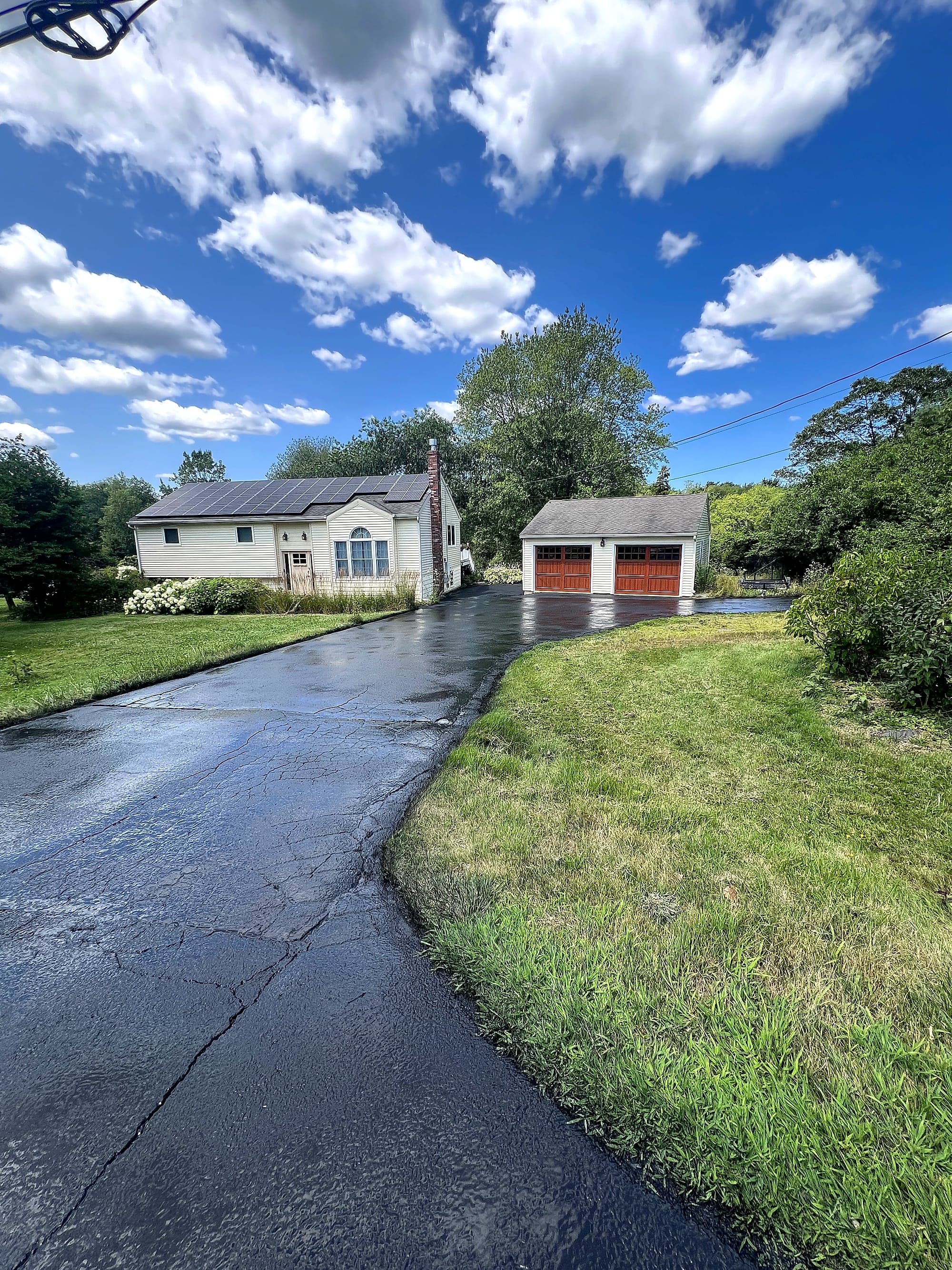 Driveway after work by Thyng Paving — deep black finish
