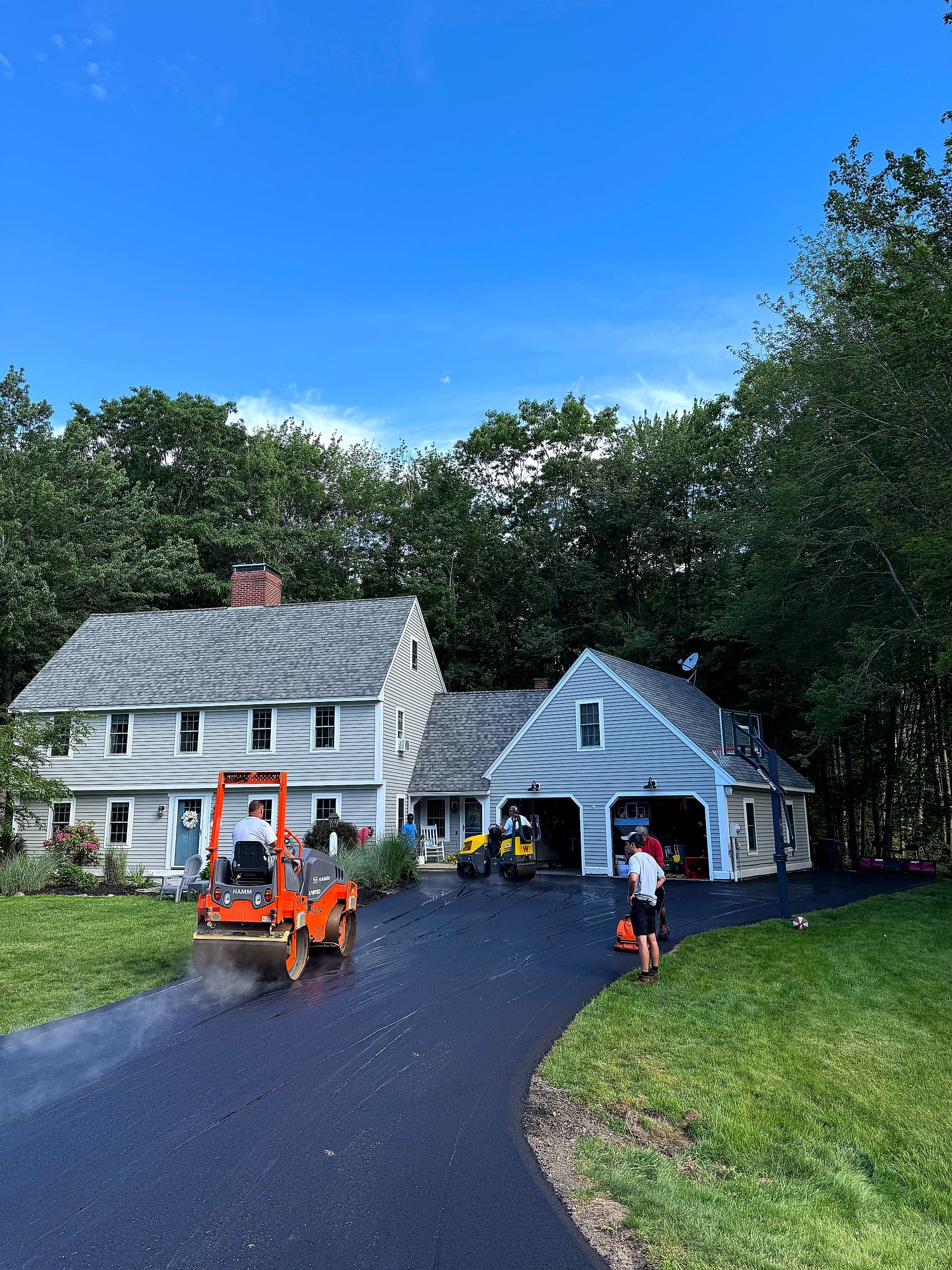 Freshly paved asphalt driveway in Maine