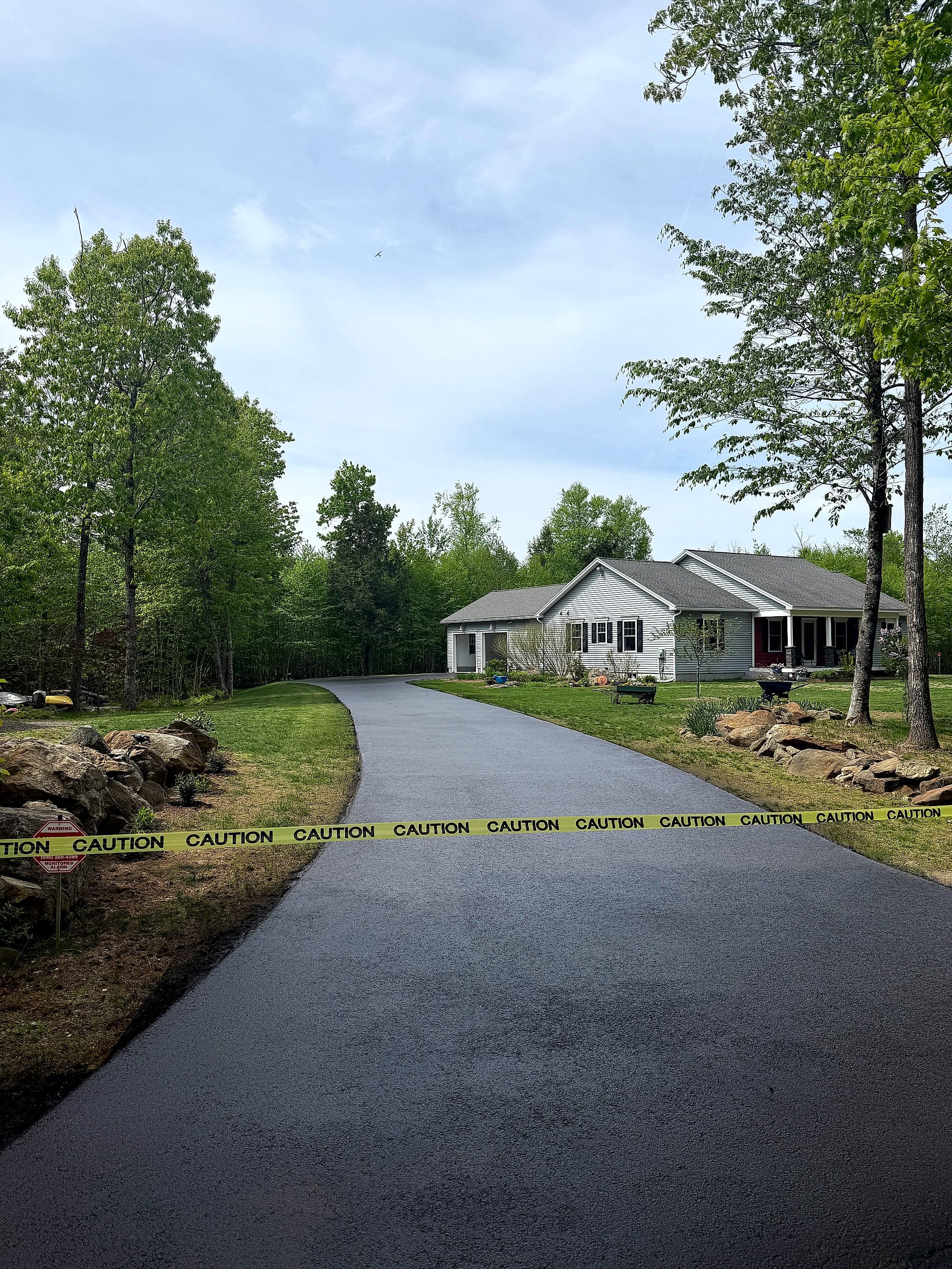 Seal coating an asphalt driveway in Maine
