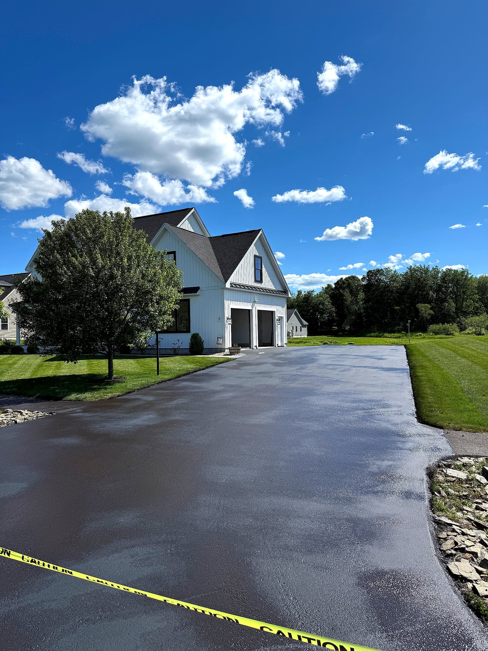 Protected seal-coated asphalt surface